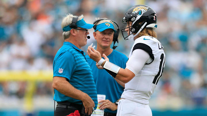 Jacksonville Jaguars quarterback Trevor Lawrence (16) talks with head coach Doug Pederson, left, as quarterbacks coach Mike McCoy looks on during the third quarter of an NFL football matchup Sunday, Sept. 15, 2024 at EverBank Stadium in Jacksonville, Fla. The Browns defeated the Jaguars 18-13. [Corey Perrine/Florida Times-Union]