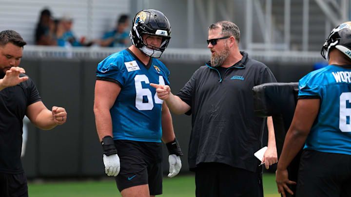 Jacksonville Jaguars guard Wyatt Milum (64) listens to offensive line coach Shaun Sarrett during a rookie minicamp at Miller Electric Center Saturday, May 10, 2025 in Jacksonville, Fla. [Corey Perrine/Florida Times-Union]