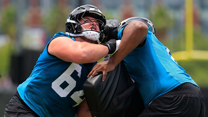 Jacksonville Jaguars guard Wyatt Milum (64), left, drills on guard Sal Wormley (61) during a rookie minicamp at Miller Electric Center Saturday, May 10, 2025 in Jacksonville, Fla. [Corey Perrine/Florida Times-Union]