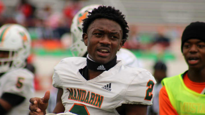 Mandarin wide receiver Jaime Ffrench Jr. (2) talks with teammates on the sideline before the FHSAA Class 4M high school football championship game against Miami Columbus on December 8, 2023. [Clayton Freeman/Florida Times-Union]