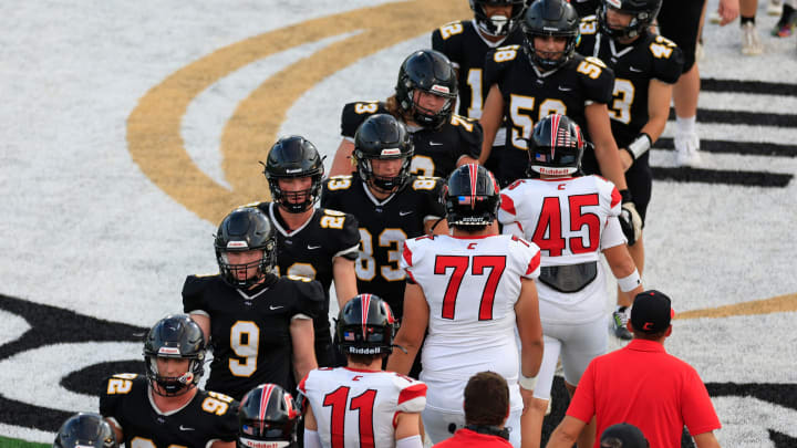 The Richmond Hill Wildcats, left, in black, and the Creekside Knights congratulate each other after the game of the Florida-Georgia Border Classic high school football matchup Saturday, Sept. 9, 2023 at Glynn County Stadium in Brunswick, Ga. The Richmond Hill Wildcats defeated the Creekside Knights 43-31