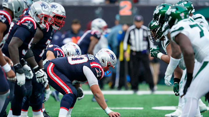 The New England Patriots offense line up against the New York Jets in the second half.