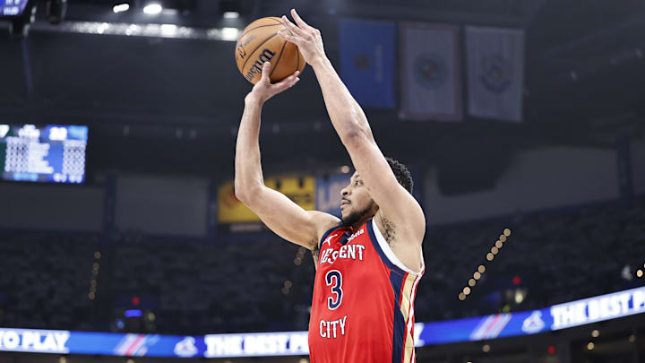 Apr 24, 2024; Oklahoma City, Oklahoma, USA; New Orleans Pelicans guard CJ McCollum (3) shoots a three-point basket against the Oklahoma City Thunder during the second quarter of game two of the first round for the 2024 NBA playoffs at Paycom Center.