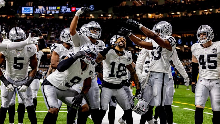 Dec 29, 2024; New Orleans, Louisiana, USA;  Las Vegas Raiders cornerback Jack Jones (18) reacts to intercepting a play from New Orleans Saints quarterback Spencer Rattler (18) during the second half at Caesars Superdome. Mandatory Credit: Stephen Lew-Imagn Images