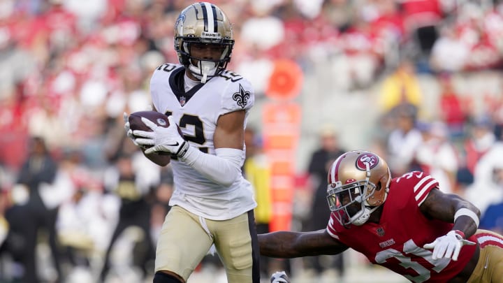 New Orleans Saints wide receiver Chris Olave (12) runs after making a catch against the San Francisco 49ers 