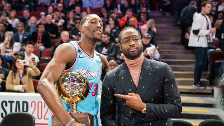 February 15, 2020; Chicago, Illinois, USA; Miami Heat center Bam Adebayo (13) poses with former Heat player Dwyane Wade- Kyle Terada/USA Today Sports