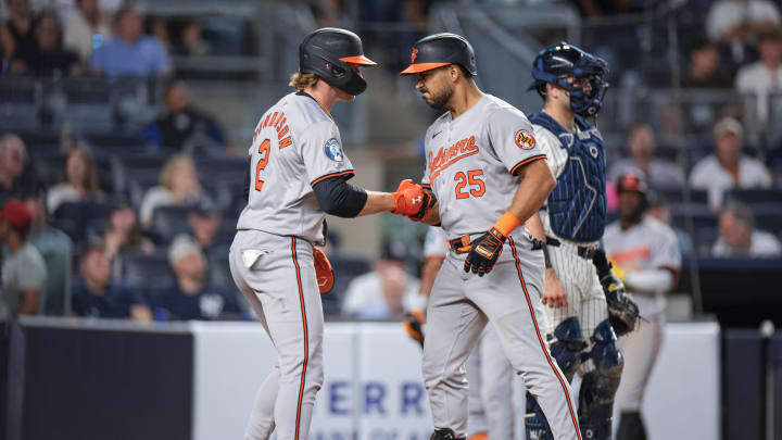 Jun 18, 2024; Bronx, New York, USA; Baltimore Orioles right fielder Anthony Santander (25) celebrates his two run home run with shortstop Gunnar Henderson (2) during the ninth inning against the New York Yankees at Yankee Stadium. Mandatory Credit: Vincent Carchietta-USA TODAY Sports Jun 18, 2024; Bronx, New York, USA; Baltimore Orioles right fielder Anthony Santander (25) celebrates his two run home run with shortstop Gunnar Henderson (2) during the ninth inning against the New York Yankees at Yankee Stadium. Mandatory Credit: Vincent Carchietta-USA TODAY Sports