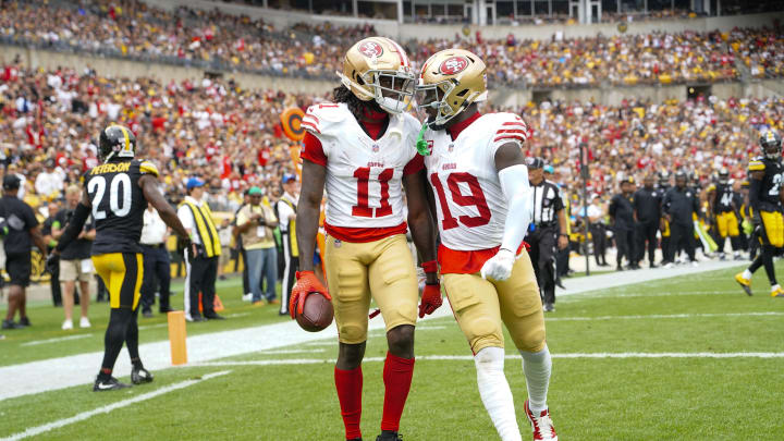 Sep 10, 2023; Pittsburgh, Pennsylvania, USA; San Francisco 49ers wide receiver Deebo Samuel (19) congratulates San Francisco 49ers wide receiver Brandon Aiyuk (11) for catching a touchdown pass against the Pittsburgh Steelers during the first half at Acrisure Stadium. Mandatory Credit: Gregory Fisher-USA TODAY Sports