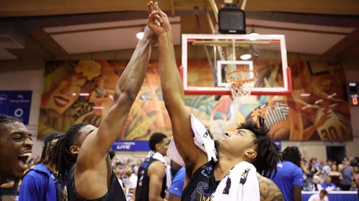 Memphis Tigers' guard Tyrese Hunter and guard PJ Haggerty celebrate after beating the UConn Huskies 99-97 in OT on Nov. 25, 2024.