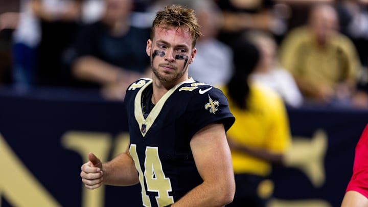 New Orleans Saints quarterback Jake Haener warms up before a game.