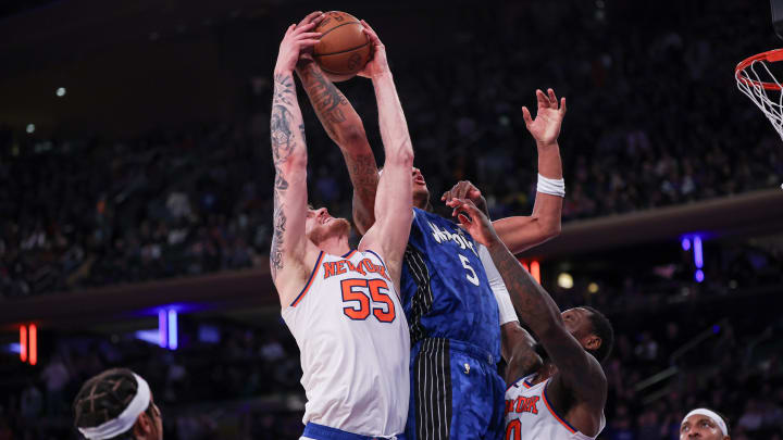 Orlando Magic forward Paolo Banchero (5) rebounds against New York Knicks center Isaiah Hartenstein (55) and forward Julius Randle (30) during the second half at Madison Square Garden.
