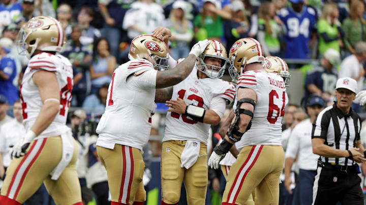 San Francisco 49ers quarterback Brock Purdy celebrates after throwing a touchdown pass against the Seattle Seahawks 