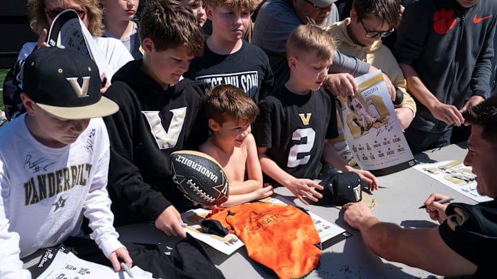 Young fans get autographs from Vanderbilt quarterback Diego Pavia (2) after the Vanderbilt Football Black and Gold Spring Game at FirstBank Stadium in Nashville, Tenn., Saturday, April 12, 2025. Young fans get autographs from Vanderbilt quarterback Diego Pavia (2) after the Vanderbilt Football Black and Gold Spring Game at FirstBank Stadium in Nashville, Tenn., Saturday, April 12, 2025.
