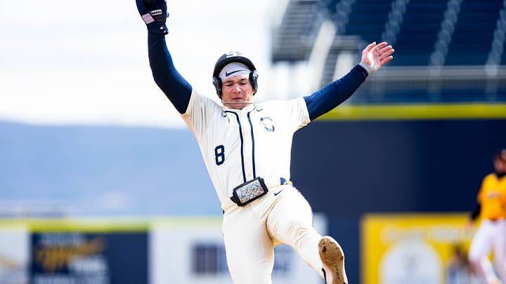 Penn State baseball's Michael Anderson (8) slides into third base safely during the game against Iowa on March 15, 2026.