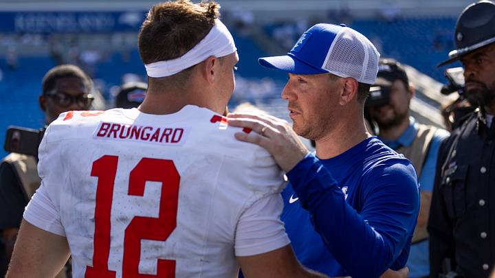 Sep 5, 2026; Lexington, Kentucky, USA;  Kentucky Wildcats head coach Will Stein speaks to Youngstown State Penguins quarterback Beau Brungard (12) after the game against the Kentucky Wildcats at Kroger Field.  Mandatory Credit: Arden Barnes-Imagn Images