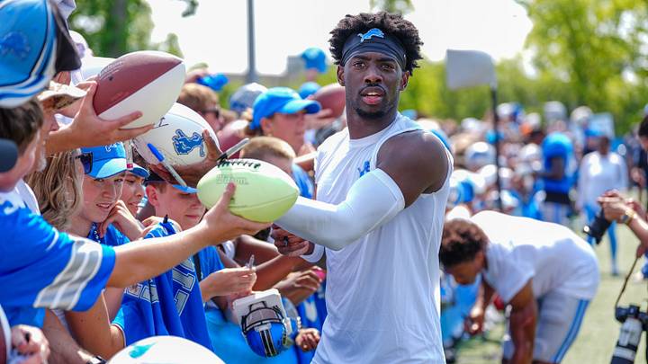 Detroit Lions CB Terrion Arnold signs autographs at the end of the joint practice with the Miami Dolphins at the Lions headquarters and training facility in Allen Park, Thursday, Aug. 14 2025.