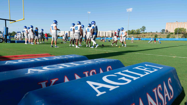 Kansas football players work on drills during an outdoor practice Thursday, Aug. 15.