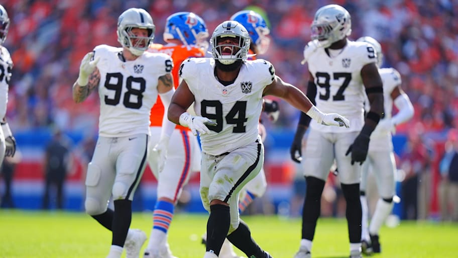 Oct 6, 2024; Denver, Colorado, USA; Las Vegas Raiders defensive tackle Christian Wilkins (94) celebrates his sack in the second quarter against the Denver Broncos at Empower Field at Mile High. | Ron Chenoy-Imagn Images