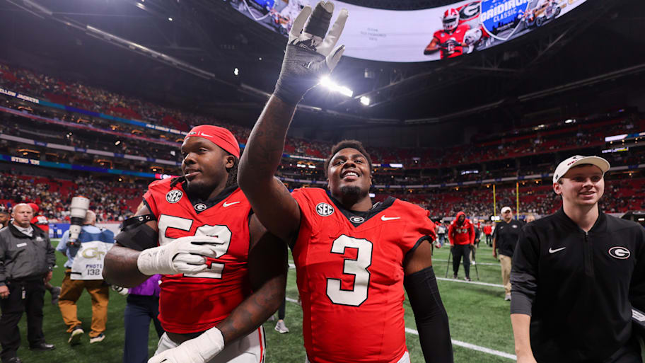 Georgia Bulldogs Christen Miller and CJ Allen celebrate a win over Georgia Tech.
