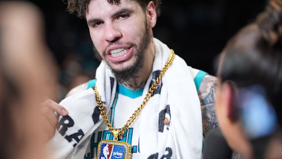 Charlotte Hornets guard LaMelo Ball is given a prime award after an overtime play-in tournament win against the Miami Heat.