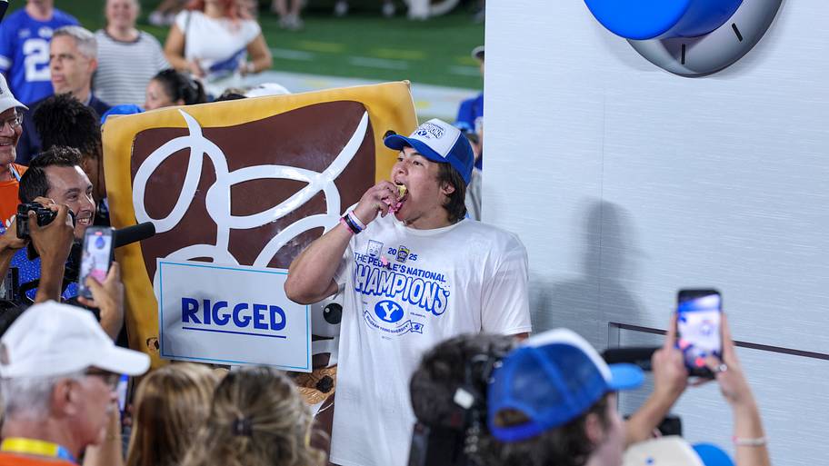 BYU Cougars quarterback Bear Bachmeier eats a Pop-Tart after beating the Georgia Tech Yellow Jackets in the Pop-Tarts Bowl.