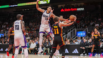 Nov 1, 2024; Atlanta, Georgia, USA; Sacramento Kings forward Keegan Murray (13) defends Atlanta Hawks guard Trae Young (11) in the fourth quarter at State Farm Arena. Mandatory Credit: Brett Davis-Imagn Images