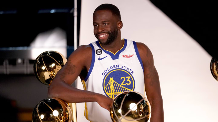 Sep 25, 2022; San Francisco, CA, USA; Golden State Warriors forward Draymond Green (23) poses with the Larry O'Brien Championship Trophies during Media Day at the Chase Center. Mandatory Credit: Cary Edmondson-USA TODAY Sports