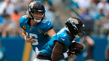 Jacksonville Jaguars quarterback Trevor Lawrence (16) hands off to Jacksonville Jaguars running back Travis Etienne Jr. (1) during the second quarter of an NFL football matchup at EverBank Stadium, Sunday, Sept. 7, 2025 in Jacksonville, Fla. 