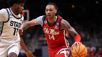 Mar 28, 2025; Atlanta, GA, USA; Mississippi Rebels guard Dre Davis (14) dribbles against Michigan State Spartans guard Jase Richardson (11) in the first half of a South Regional semifinal of the 2025 NCAA tournament at State Farm Arena. Mandatory Credit: Brett Davis-Imagn Images