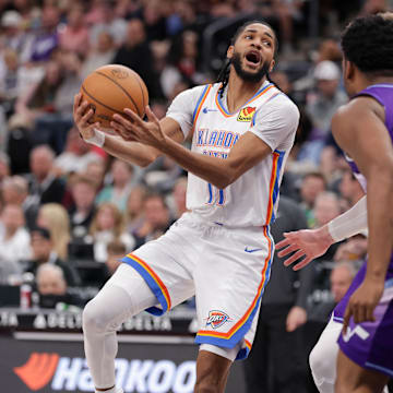 Apr 11, 2025; Salt Lake City, Utah, USA;  Oklahoma City Thunder guard Isaiah Joe (11) tries to past the ball against the Utah Jazz during the second quarter at Delta Center. Mandatory Credit: Chris Nicoll-Imagn Images