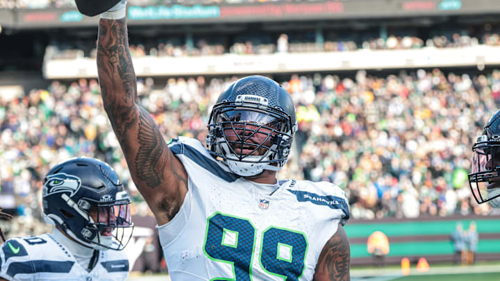 Dec 1, 2024; East Rutherford, New Jersey, USA; Seattle Seahawks defensive end Leonard Williams (99) celebrates his interception return for a touchdown during the first half against the New York Jets at MetLife Stadium. Mandatory Credit: Vincent Carchietta-Imagn Images Dec 1, 2024; East Rutherford, New Jersey, USA; Seattle Seahawks defensive end Leonard Williams (99) celebrates his interception return for a touchdown during the first half against the New York Jets at MetLife Stadium. Mandatory Credit: Vincent Carchietta-Imagn Images