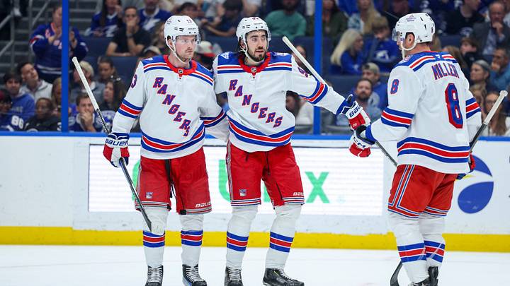 Apr 15, 2026; Tampa, Florida, USA; New York Rangers center Mika Zibanejad (93) (center) reacts with left wing Alexis Lafrenière (13) (left) and center J.T. Miller (8) (right) after scoring a goal against the Tampa Bay Lightning in the second period at Benchmark International Arena. Mandatory Credit: Nathan Ray Seebeck-Imagn Images