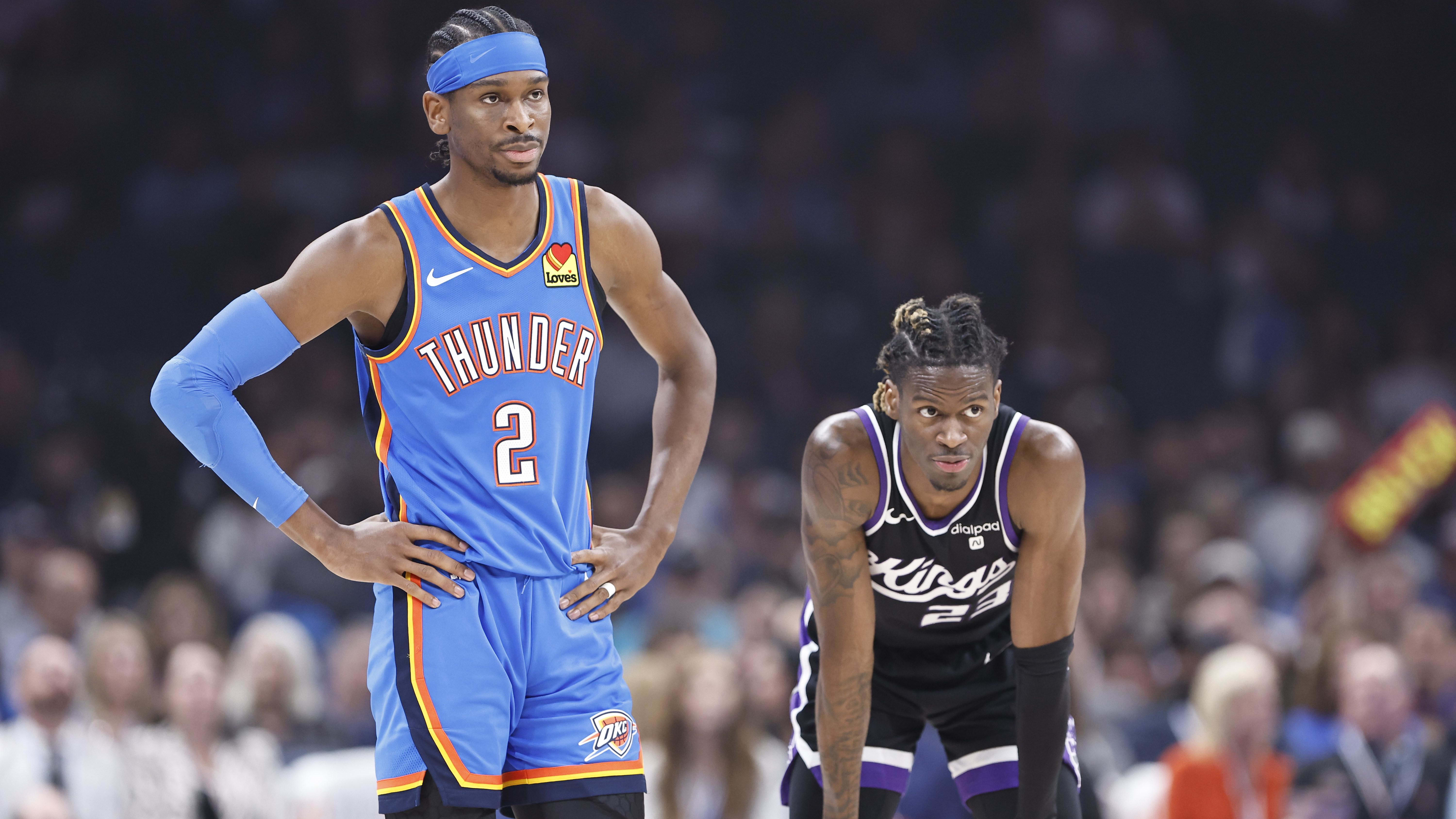 Apr 9, 2024; Oklahoma City, Oklahoma, USA; Oklahoma City Thunder guard Shai Gilgeous-Alexander (2) and Sacramento Kings guard Keon Ellis (23).