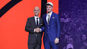 Jun 25, 2025; Brooklyn, NY, USA;  Liam McNeeley stands with NBA commissioner Adam Silver after being selected as the 29th pick by the Phoenix Suns in the first round of the 2025 NBA Draft at Barclays Center. Mandatory Credit: Brad Penner-Imagn Images