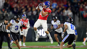 Mississippi Rebels tight end Caden Prieskorn (86) hauls in a reception between Duke Blue Devils linebacker Alex Howard (3) and safety DaShawn Stone (8) during the first quarter of the TaxSlayer Gator Bowl Thursday, Jan. 2, 2025 at EverBank Stadium in Jacksonville, Fla. [Corey Perrine/Florida Times-Union]
