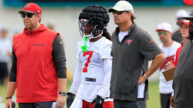 Tampa Bay Buccaneers running back Bucky Irving (7) looks on during a combined NFL football training camp session between the 