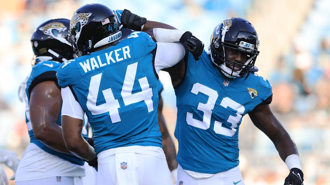 Jacksonville Jaguars linebacker Travon Walker (44) greets linebacker Devin Lloyd (33) before the game of a preseason matchup Saturday, Aug. 26, 2023, at EverBank Stadium in Jacksonville, Fla. [Corey Perrine/Florida Times-Union]