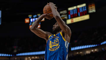 Andrew Wiggins of the Golde State Warriors attempts a shot against the Portland Trail Blazers