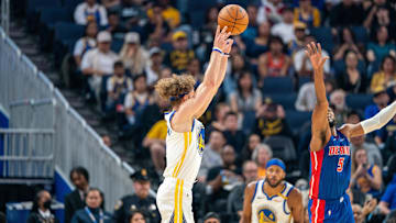 Oct 13, 2024; San Francisco, California, USA;  Golden State Warriors guard Brandin Podziemski (2) shoots a three point shot over Detroit Pistons guard Malik Beasley (5): Neville E. Guard-Imagn Images