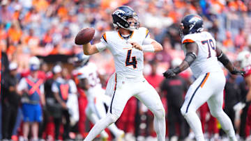 Aug 25, 2024; Denver, Colorado, USA; Denver Broncos quarterback Zach Wilson (4) prepares to pass in the second quarter against the Arizona Cardinals at Empower Field at Mile High.