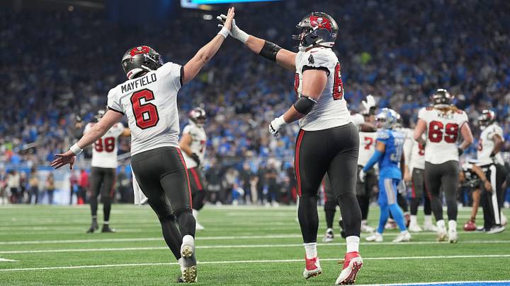 Tampa Bay Buccaneers QB Baker Mayfield celebrates a touchdown against the Detroit Lions.