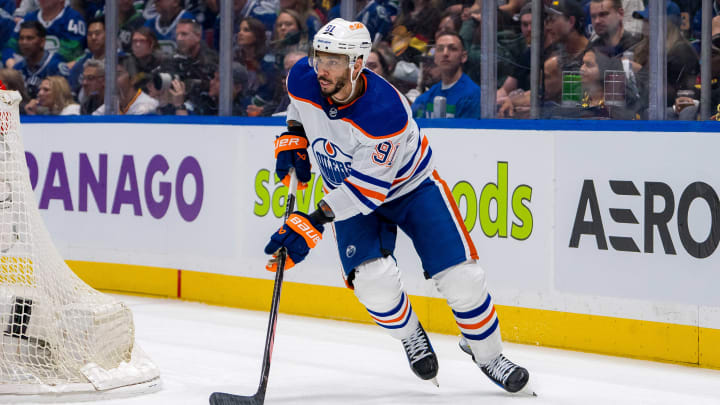 May 16, 2024; Vancouver, British Columbia, CAN; Edmonton Oilers forward Evander Kane (91) handles the puck against the Vancouver Canucks during the third period in game five of the second round of the 2024 Stanley Cup Playoffs at Rogers Arena. Mandatory Credit: Bob Frid-USA TODAY Sports