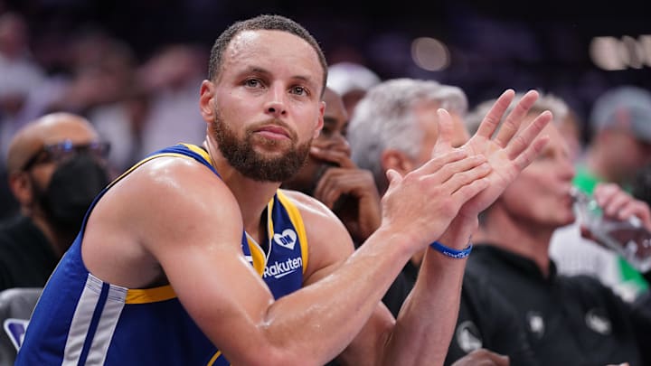 Apr 16, 2024; Sacramento, California, USA; Golden State Warriors guard Stephen Curry (30) sits on the bench during action against the Sacramento Kings in the fourth quarter during a play-in game of the 2024 NBA playoffs at the Golden 1 Center. 