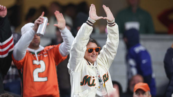 Dec 28, 2023; Bronx, NY, USA; Miami Hurricanes fans cheer during the second half of the 2023 Pinstripe Bowl against the Rutgers Scarlet Knights at Yankee Stadium. Mandatory Credit: Vincent Carchietta-USA TODAY Sports