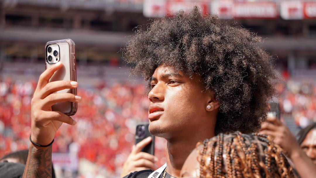 Aug 31, 2024; Columbus, OH, USA; Mater Dei wide receiver Chris Henry Jr. films as Ohio State football warms up before the Buckeyes' 52-6 win over Akron.