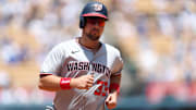 Jun 22, 2025; Los Angeles, California, USA; Washington Nationals first baseman Nathaniel  Lowe (33) hits a home run during the third inning against The Los Angeles Dodgers at Dodger Stadium