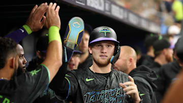 May 3, 2024; St. Petersburg, Florida, USA; Tampa Bay Rays second base Curtis Mead (25) is congratulated in the dugout after he scored a run against the New York Mets during the second inning at Tropicana Field. Mandatory Credit: Kim Klement Neitzel-Imagn Images
