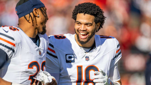 Chicago Bears quarterback Caleb Williams (18) and Chicago Bears safety Jonathan Owens (36) 