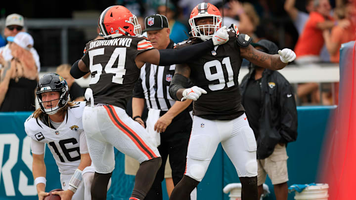 Cleveland Browns defensive end Alex Wright (91) celebrates his sack on Jacksonville Jaguars quarterback Trevor Lawrence (16) in the end zone for a safety with defensive end Ogbo Okoronkwo (54) during the fourth quarter of an NFL football matchup Sunday, Sept. 15, 2024 at EverBank Stadium in Jacksonville, Fla. The Browns defeated the Jaguars 18-13. [Corey Perrine/Florida Times-Union]