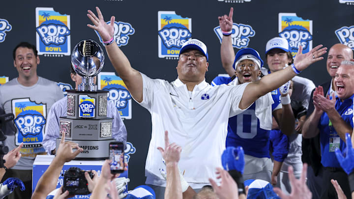 Dec 27, 2025; Orlando, FL, USA; BYU Cougars head coach Kalani Sitake celebrates after beating Georgia Tech Yellow Jackets in the Pop-Tarts Bowl at Camping World Stadium. Mandatory Credit: Nathan Ray Seebeck-Imagn Images
